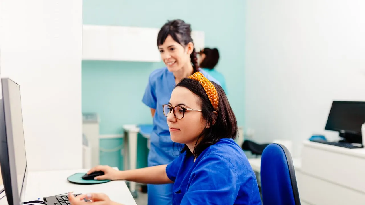 nurse wearing glasses working in healthcare setting